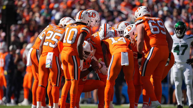 Oct 8, 2023; Denver, Colorado, USA; Denver Broncos quarterback Russell Wilson (3) (center) huddles with teammates in the first quarter against the New York Jets at Empower Field at Mile High. Mandatory Credit: Ron Chenoy-USA TODAY Sports